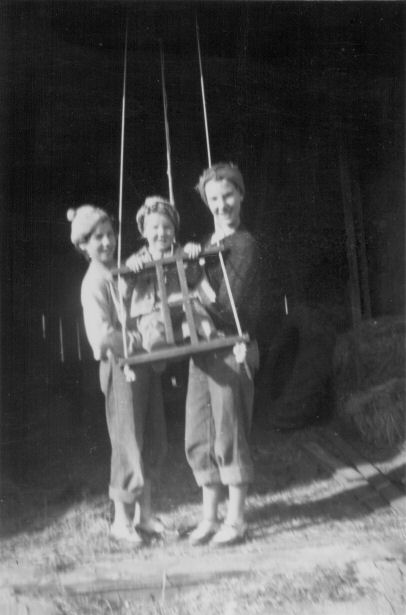 Dana Lou Sams, Karen Sue Sams (in her swing), Dixie Lee Sams, taken in the door of the barn