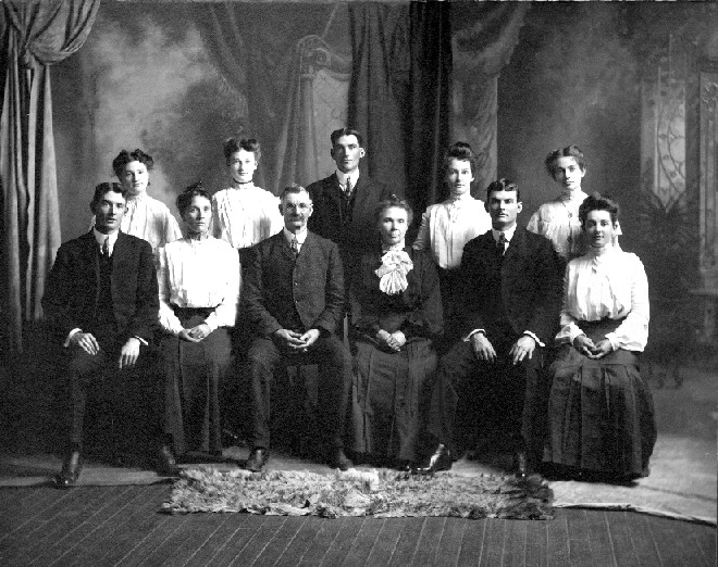 Mr. and Mrs. Thomas Holmes and family -- Front Row (L-R): Will, Anna, Thomas, Mary Louise Lillis, Joe, Lillie - Back Row (L-R): Mary Magadelene, Fanny, Clarence (Doc), Clara, Maggie