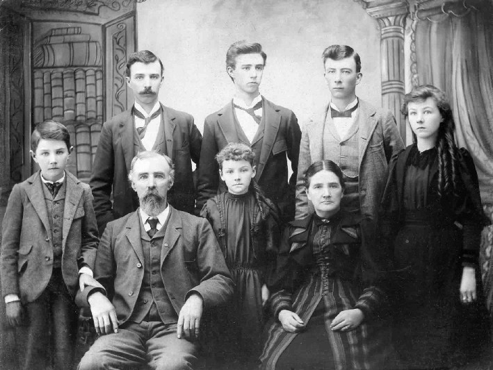 WM. H. Beck, Photographer Morrisonville, IL - Front (L-R) Tom Stevens, Nathan Stevens, Anna Stevens, Emma J. (Layne) Stevens, Rosa Nell (Nellie) Stevens; Back (L-R) Walter Stevens, Eugene Stevens, Harry Stevens